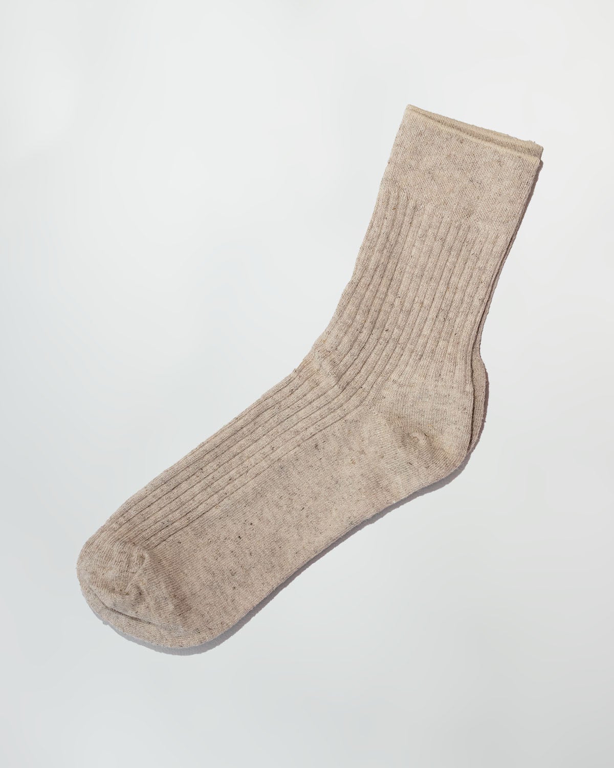 Single oatmeal Hemp Crew Sock laid flat, showing the ribbed knit